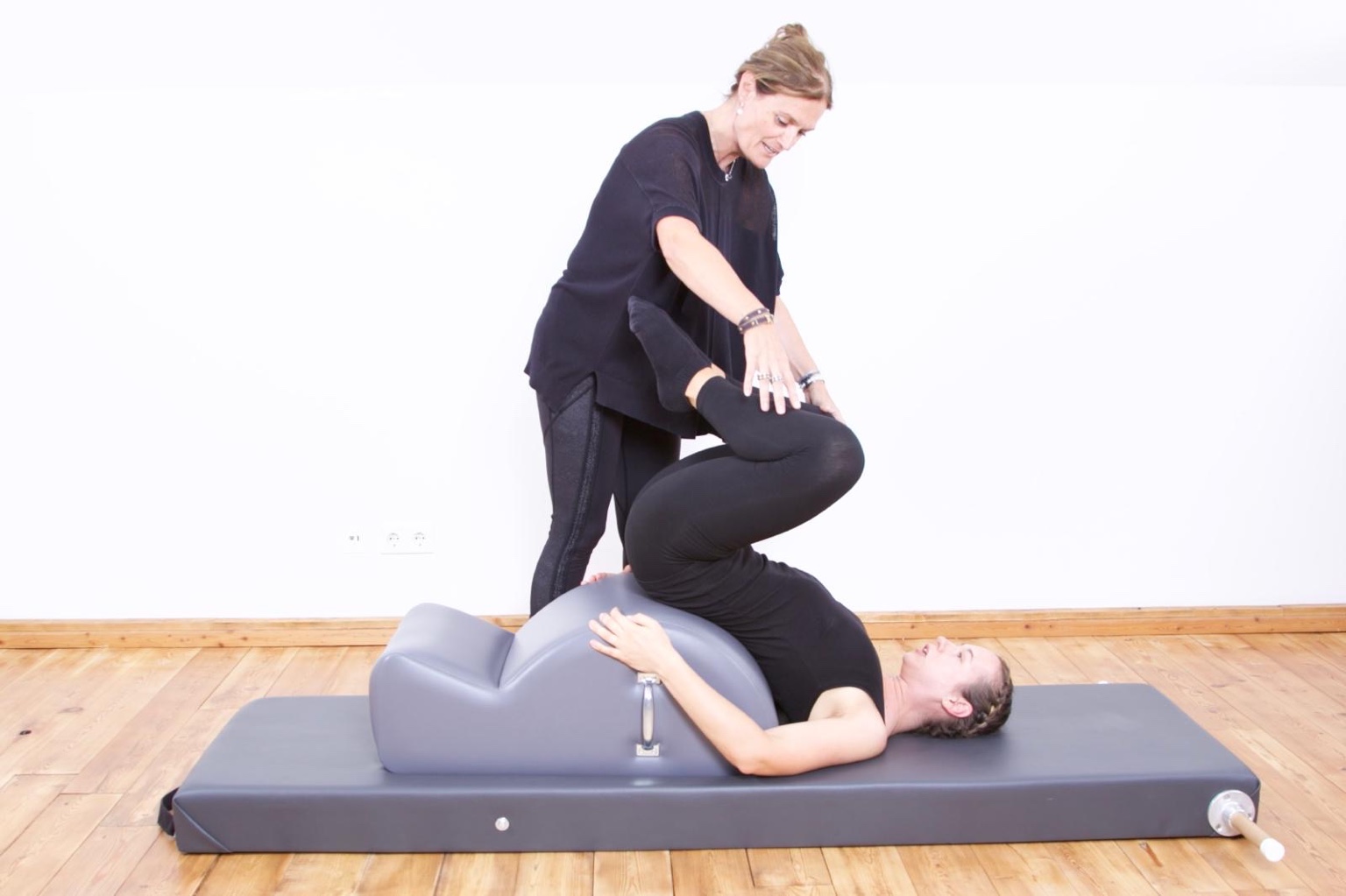Murielle Pickard-Dellis providing hands-on Pilates instruction